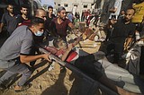 Israel launches 400 strikes across Gaza, where health officials say hundreds of Palestinians killed