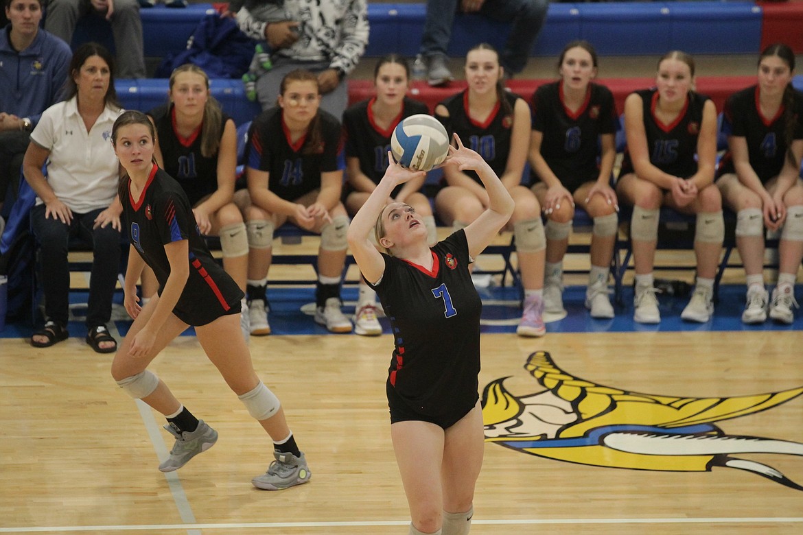 MARK NELKE/Press
Bailey Jaworski (7) of Coeur d'Alene sets as right side hitter Kiley Hart (9) approaches in last week's 5A Region 1 volleyball championship match at Viking Court.