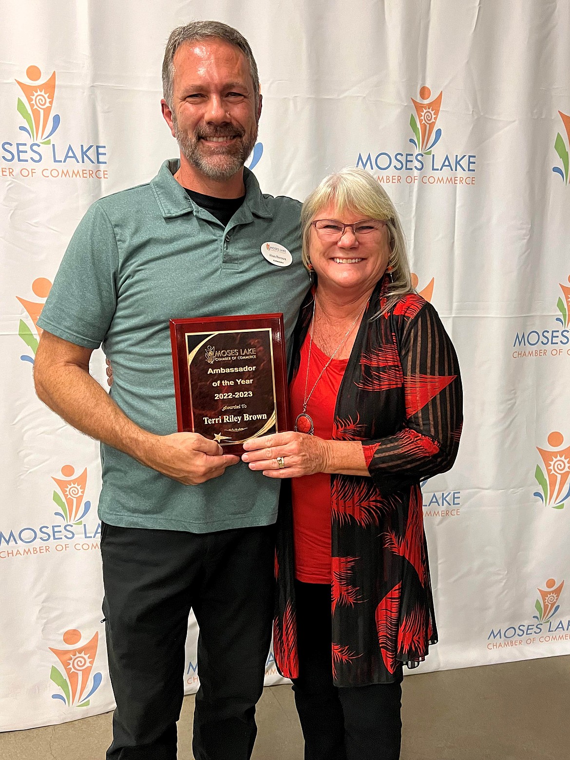 Moses Lake Chamber of Commerce General Ambassador Alan Heroux, left, presents ambassador Terri Riley Brown with the Ambassador of the Year award at the chamber’s annual meeting Oct. 17.