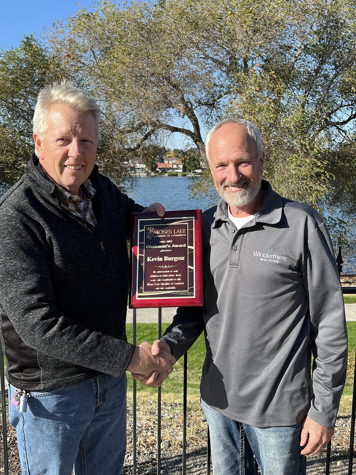 Outgoing Moses Lake Chamber of Commerce Chair Jim McKiernan, left, presents Kevin Burgess with the Chairman’s Award, in recognition of Burgess’ service to the community.