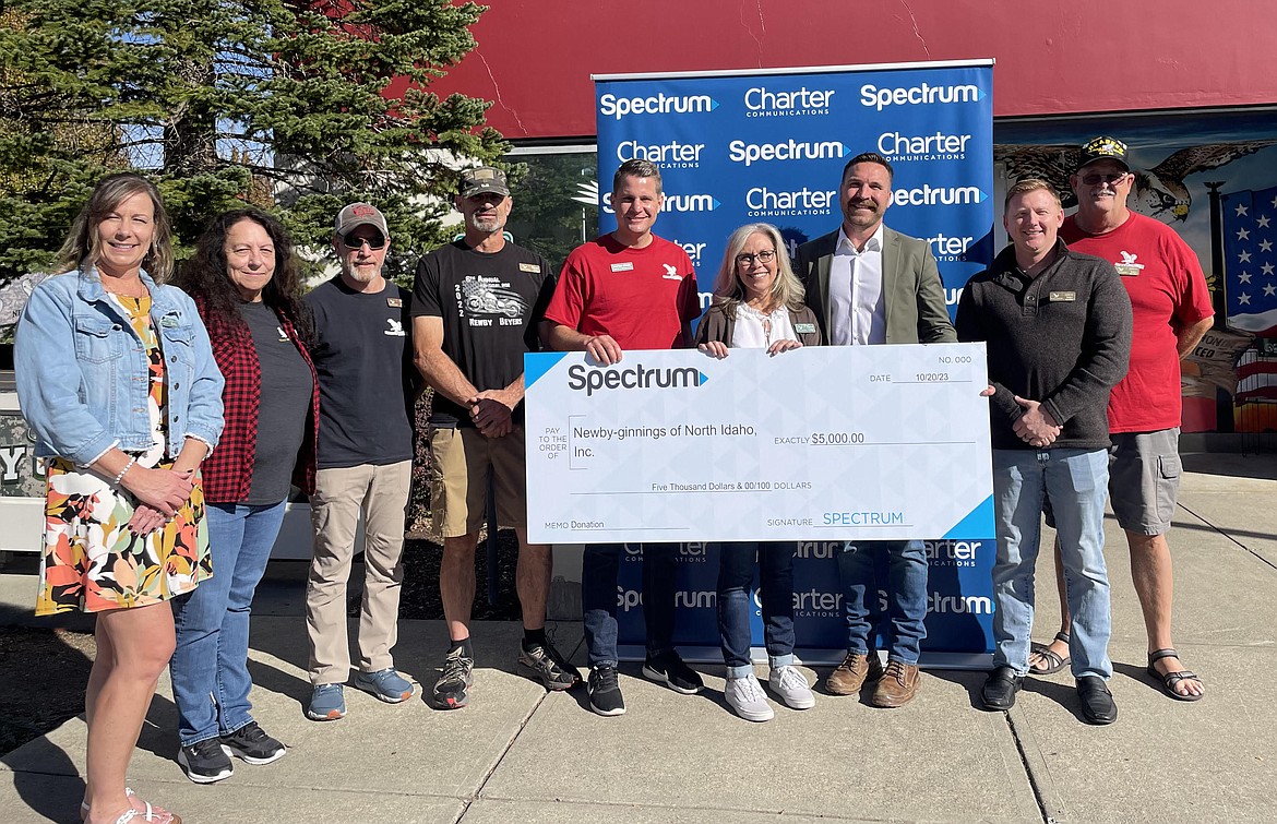 Spectrum and Idaho State Rep. Jordan Redman, R-Coeur d'Alene, each donated $5,000 to veterans service nonprofit Newby-ginnings of North Idaho for a total of $10,000 during a presentation Oct. 20. From left: Kelly Glenn, Lynn Thompson, Cliff Drake, Dean Morfitt, Stafford Strong, Theresa Hart, Redman, Drew McConnell and Greg Munden.
