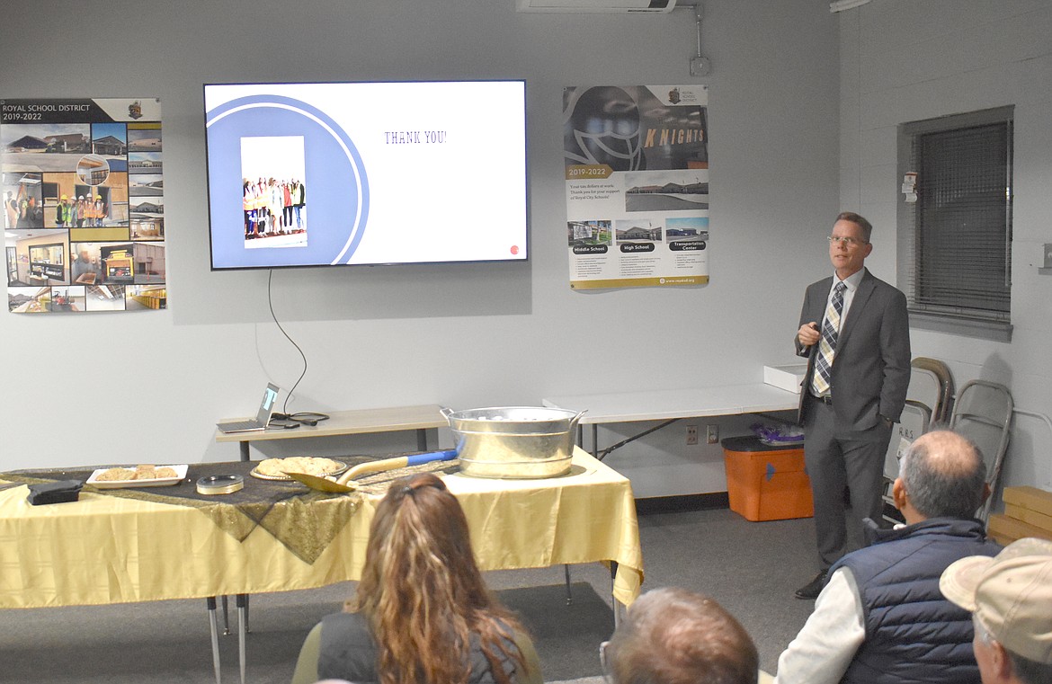 Royal School District Roger Trail, right, shares a slide presentation with a small group of attendees at the district’s event celebrating the completion of construction projects on the district’s buildings.