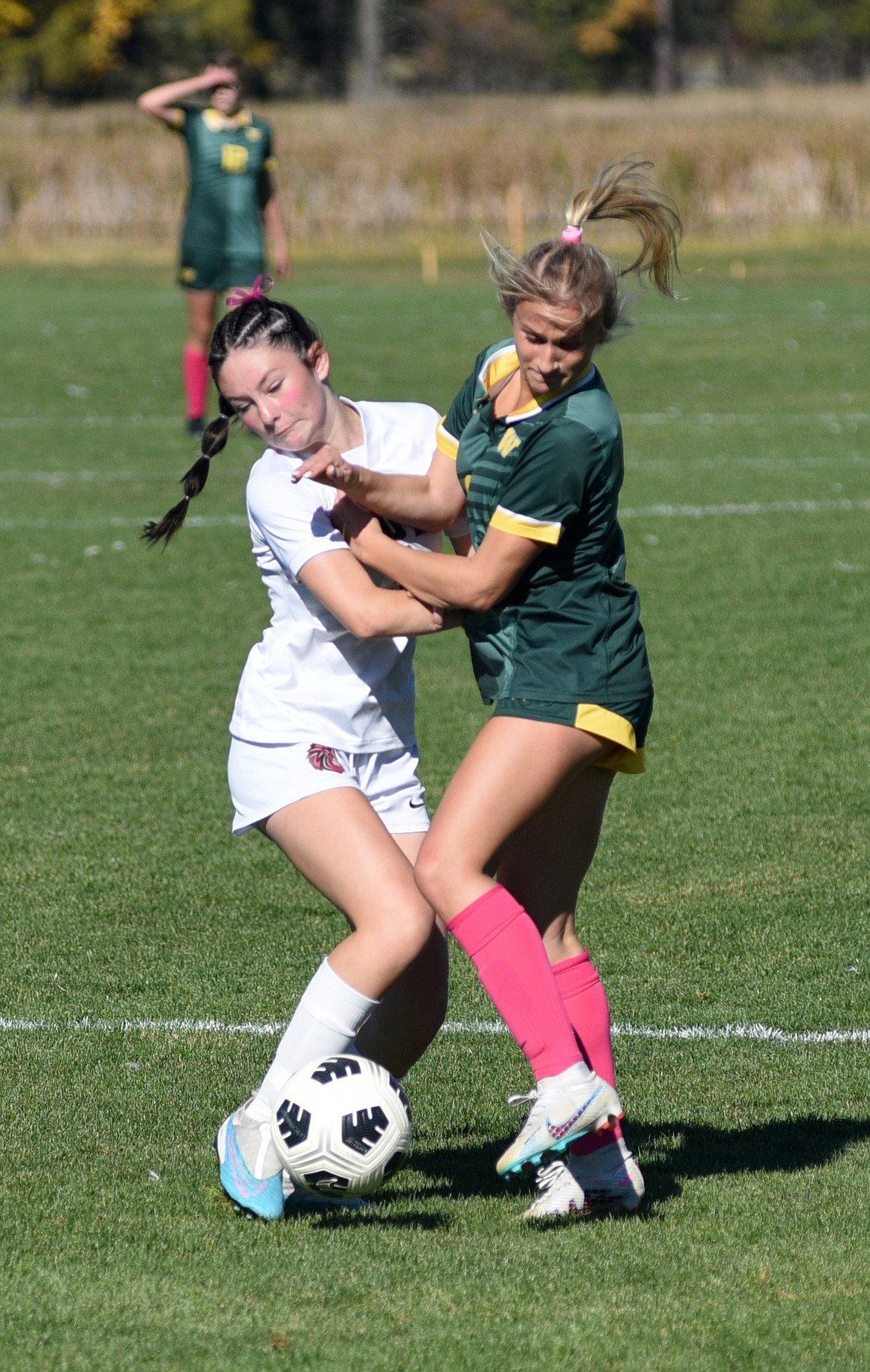 Whitefish junior Sadie Olson battles for position against Lockwood in the State A semifinal match at Whitefish on Saturday, Oct. 21. (Matt Baldwin/Whitefish Pilot)