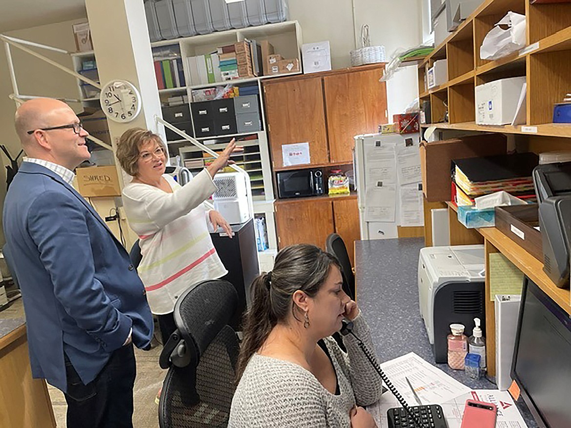 Idaho Secretary of State Phil McGrane talks to Boundary County Clerk Glenda Poston during a tour last week of North Idaho's elections offices.