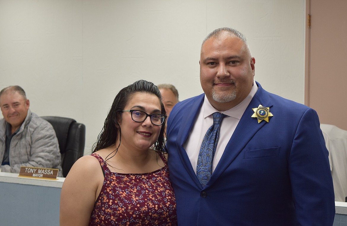 Newly-appointed Warden Police Sgt. Greg Talbot stands in the Warden Police Station with his wife Veronica after the badge-pinning.