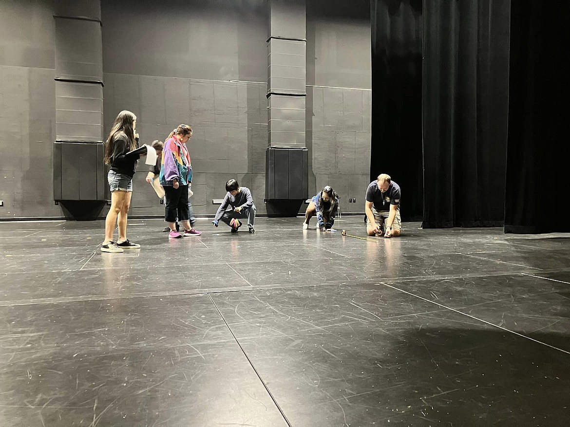 The tech crew starts laying out the stage for the Quincy High School production of “Murder on the Orient Express” in September.