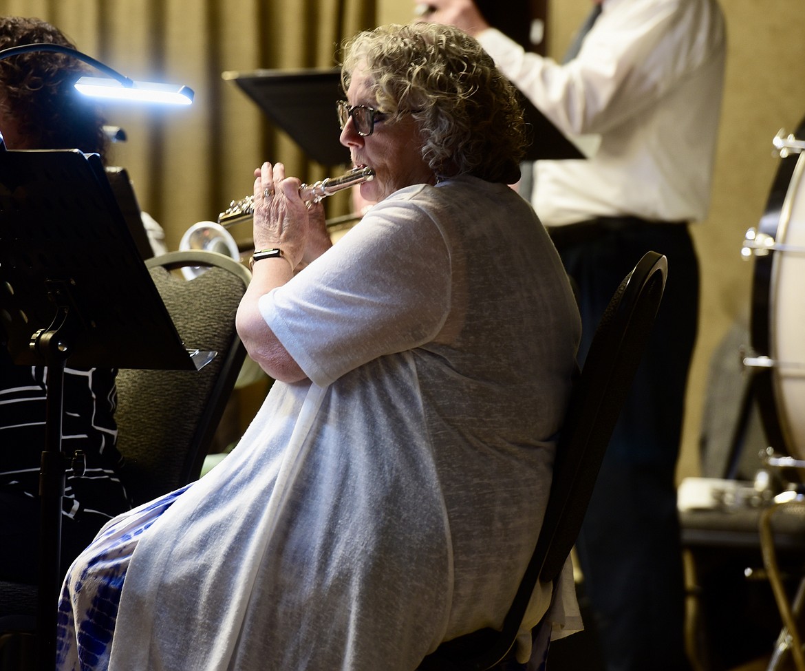 Laurieanne Stewart plays the flute with the Flathead Valley New Horizons Band during their fall concert Oct. 19 at the Red Lion in Kalispell. (Heidi Desch/Daily Inter Lake)