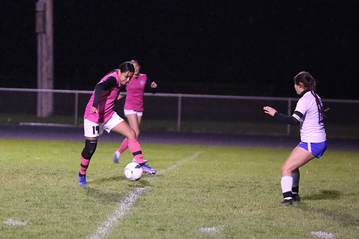 Wahluke sophomore Yaria Gonzalez (19) starts to pass the ball to a teammate near the Kiona-Benton net.