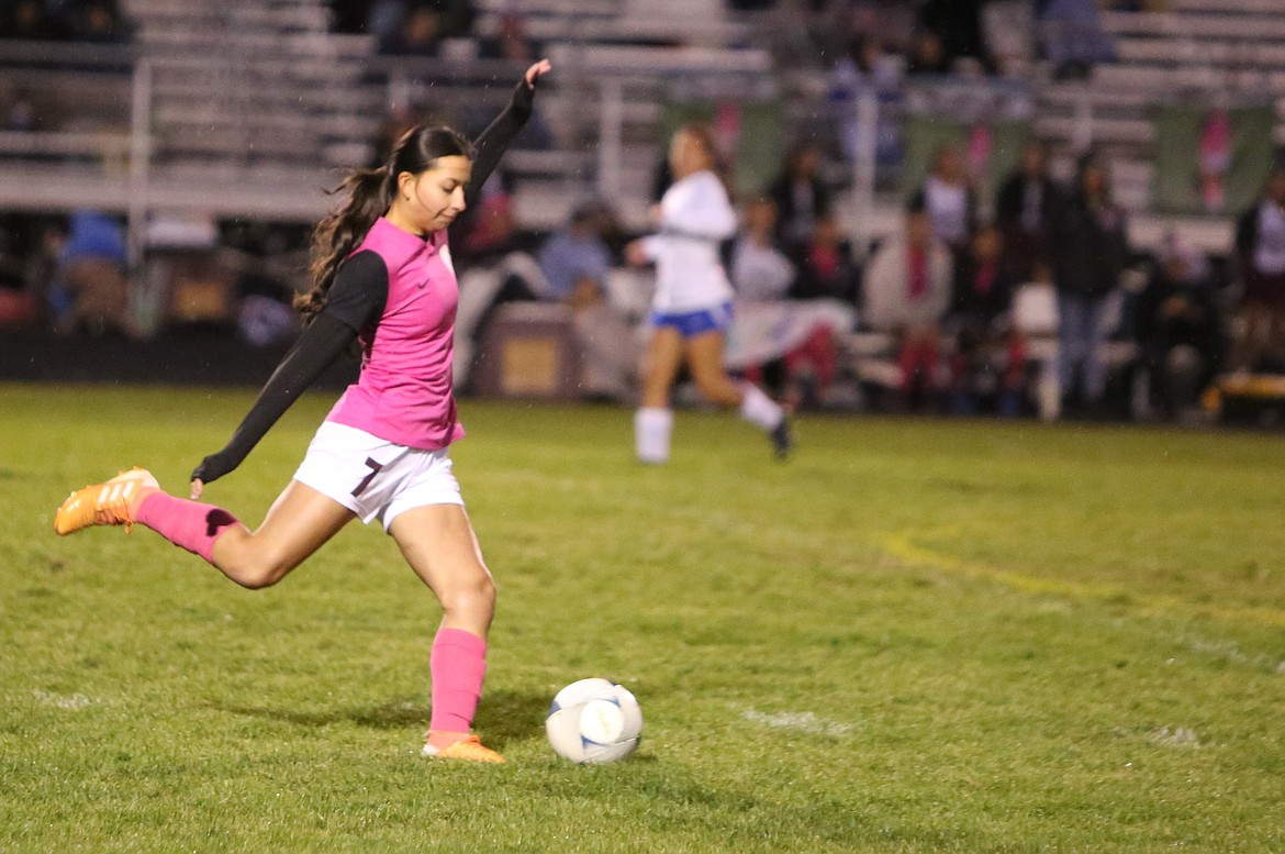 Wahluke junior Maria Barajas kicks the ball upfied in the first half against Kiona-Benton.