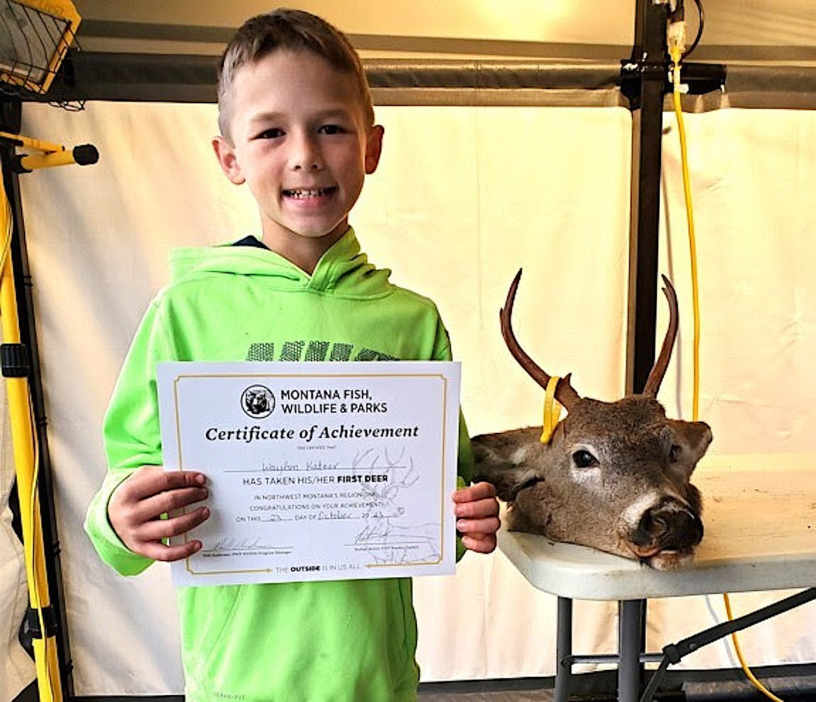 Waylon Katzer poses with his 2x3 white-tailed buck that he harvested in the Libby area. (Photo courtesy Montana Fish, Wildlife and Parks)