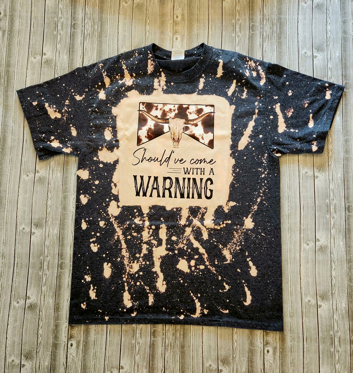 Tracy Crostley uses bleach and various forms of lettering in her custom t-shirts.