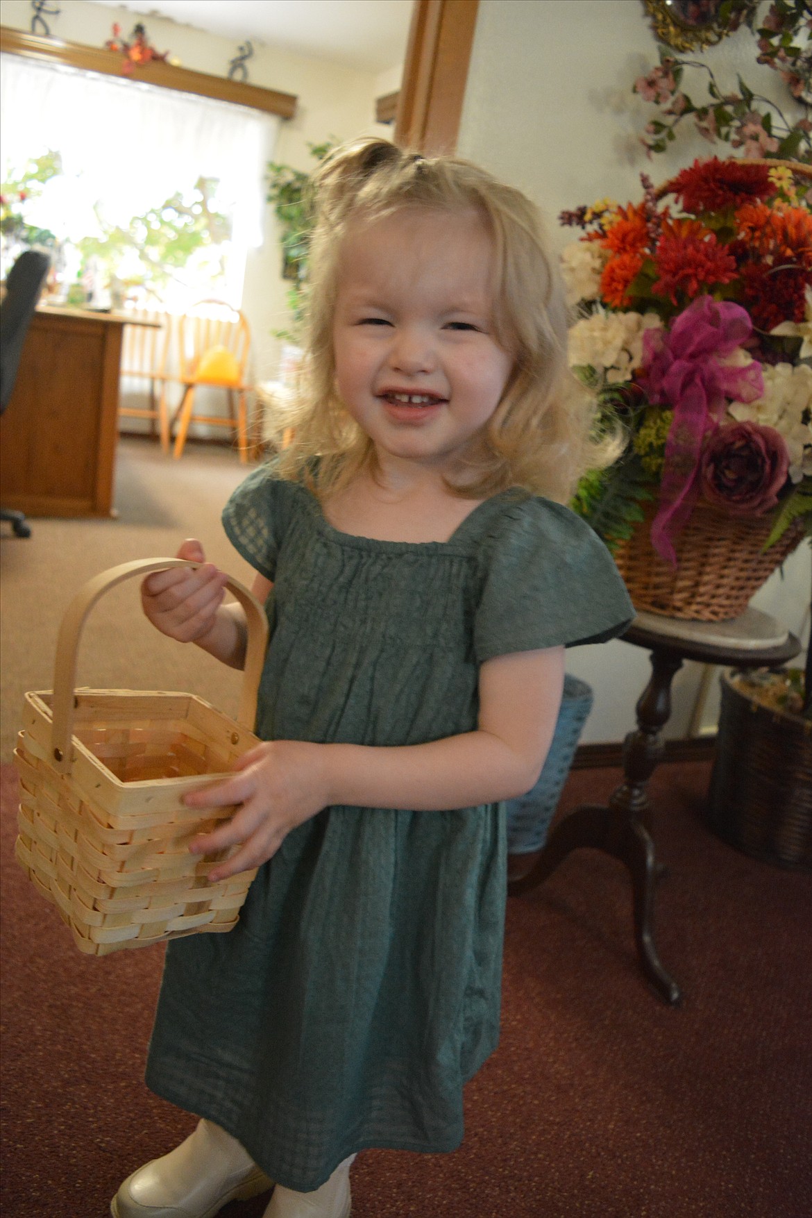 Ruthie gets ready to pass out mini pumpkins and throw flowers petals before her great-grandparents renew their vows.