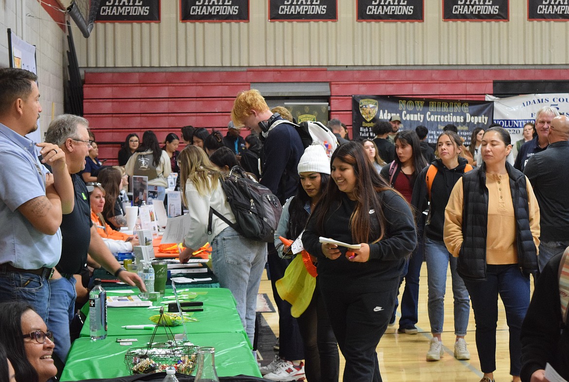 Othello students attending the 2023 Othello Career Showcase Tuesday speak to representatives of Ladd Irrigation, which has offices across the Columbia Basin, including in Othello.