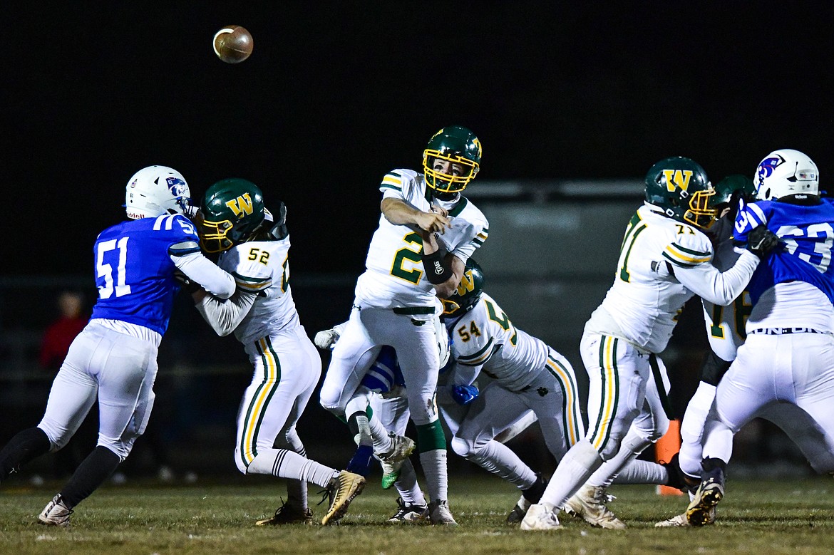 Whitefish quarterback Carson Gulick (2) drops back to pass in the first quarter against Columbia Falls at Satterthwaite Field on Friday, Oct. 27. (Casey Kreider/Daily Inter Lake)