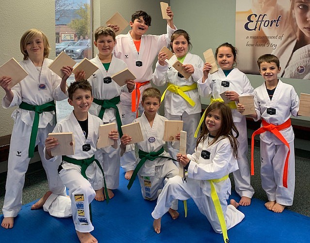 Sandpoint Martial Arts athletes pose for a photo after completing their belt testing earlier this month. Pictured, front row, left to right, Maison Nelson (Green Belt), Lukas Nelson (Green Belt), Karlyn Elsbury (Yellow Belt). Back row, left to right, Colton Straub (Green Belt), Naish Nelson (Green Belt), Ethan Garza (Orange Belt), Ellie Benavides (Yellow Belt), Avery Benavides (Yellow Belt), George Vanderbeek (Orange Belt).