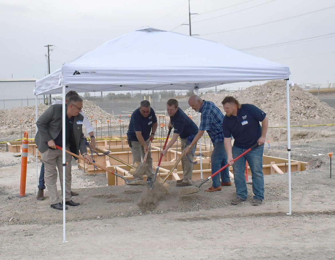 Dirt flies at the groundbreaking Oct. 9 for OneD Battery Sciences’ silane offloading station, part of the company’s new Moses Lake facility. OneD Battery Sciences uses silicon to increase battery efficiency and affordability for electric vehicles, according to company officials. From left: Port of Moses Lake Commissioner Darrin Jackson, On D Chief Operations Officer Jan Marc Luchies (partially hidden behind Jackson), OneD Operations Engineer Rufino Garza, OneD Moses Lake Site Manager Nick Kamerath, Moses Lake City Council Member David Eck and OneD Construction Manager Tyson Olson.