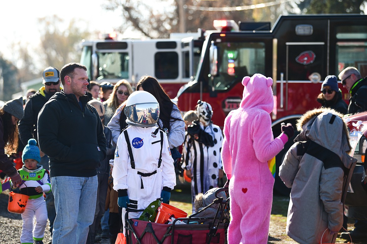 Children in costumes participate in the trunk or treat event at the Boys and Girls Club of Glacier Country headquarters in Evergreen on Saturday, Oct. 28. The event was sponsored by the Flathead County Sheriff Posse, Evergreen Chamber of Commerce and local first responders. (Casey Kreider/Daily Inter Lake)