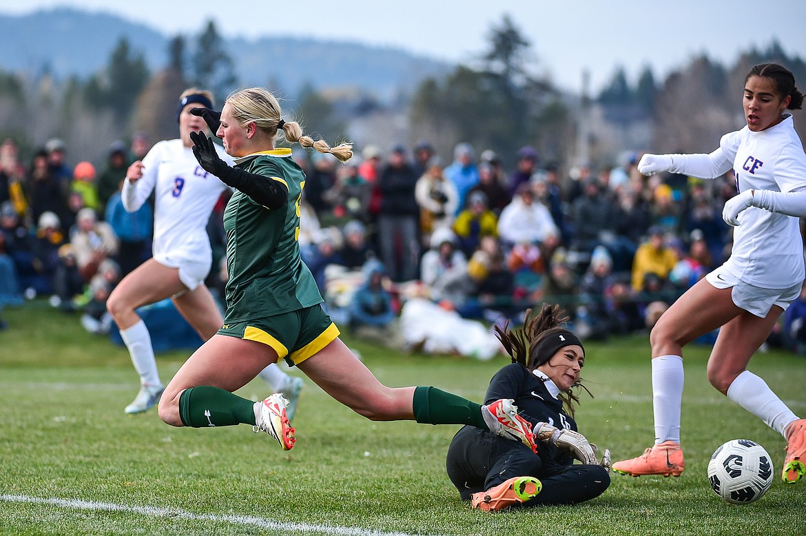 Columbia Falls goalkeeper Erica Burguiere (1) makes a save against Whitefish's Delaney Smith (9) in the second half of the Class A state championship at Smith Fields on Saturday, Oct. 26. (Casey Kreider/Daily Inter Lake)