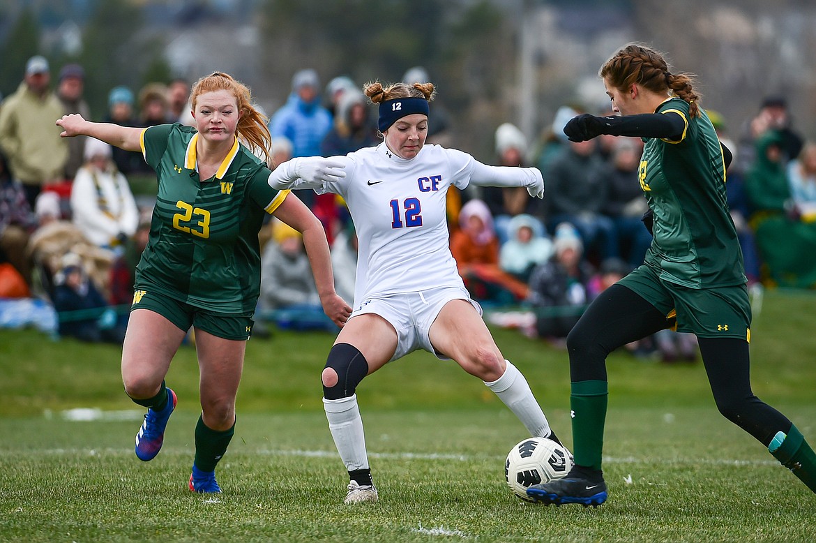 Columbia Falls Josie Harris (12) pushes the ball into the Whitefish zone  in the first half of the Class A state championship at Smith Fields on Saturday, Oct. 26. (Casey Kreider/Daily Inter Lake)