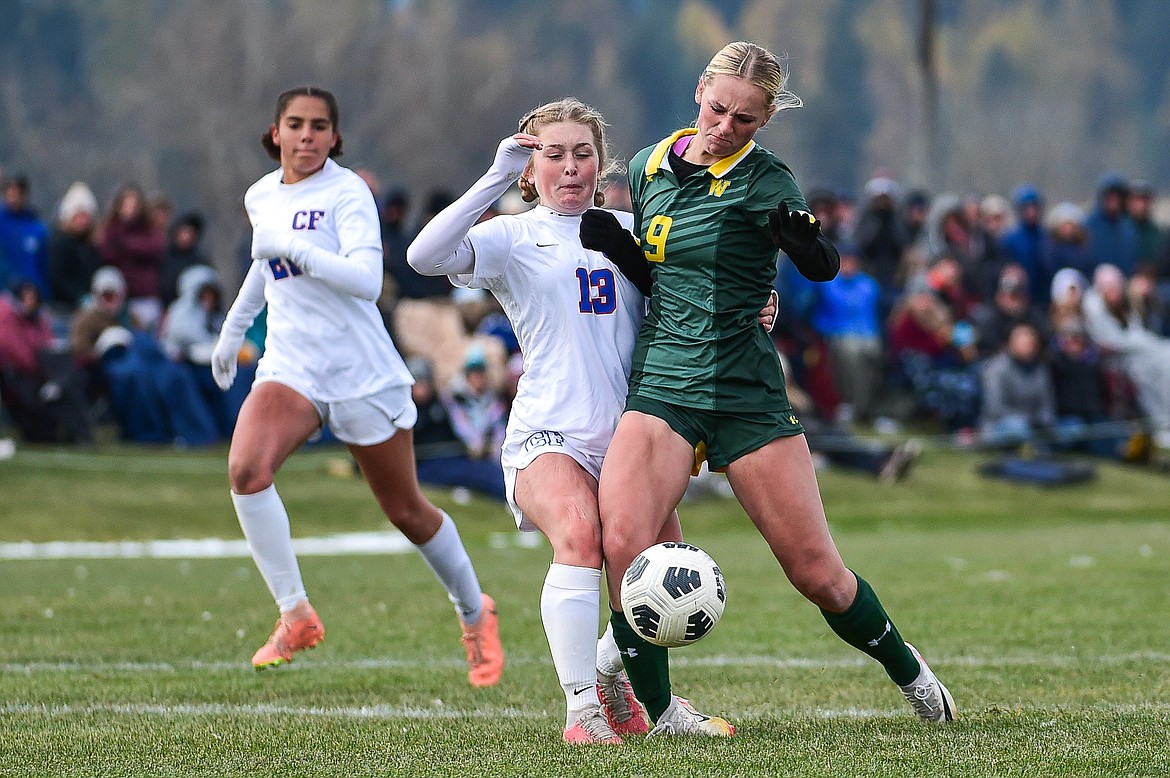 Columbia Falls' Alexa Friske (13) challenges Whitefish's Delaney Smith (9) in the second half of the Class A state championship at Smith Fields on Saturday, Oct. 26. (Casey Kreider/Daily Inter Lake)