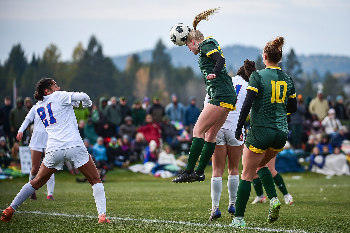 Whitefish's Isabelle Cooke (20) heads a ball on goal off a corner kick in the second half against Columbia Falls in  the Class A state championship at Smith Fields on Saturday, Oct. 26. (Casey Kreider/Daily Inter Lake)