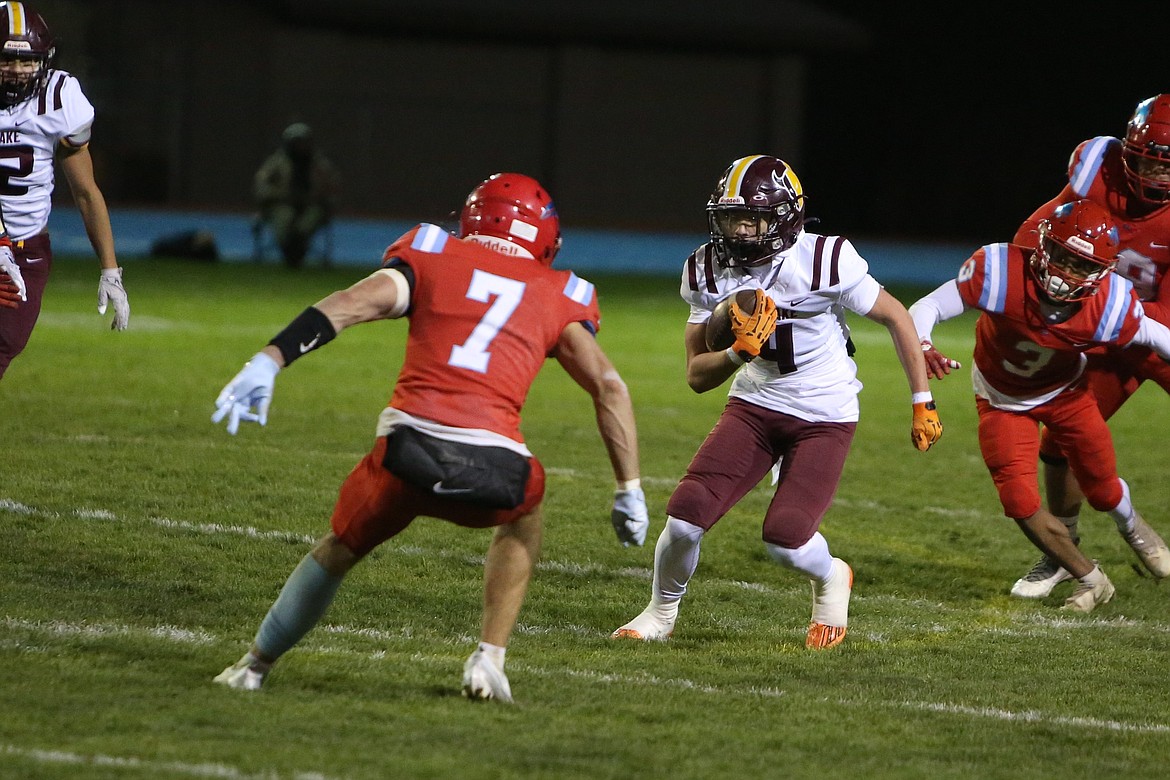 Moses Lake sophomore Carson Huberdeau (4) looks to shake off an Eastmont defender in the third quarter against the Wildcats.