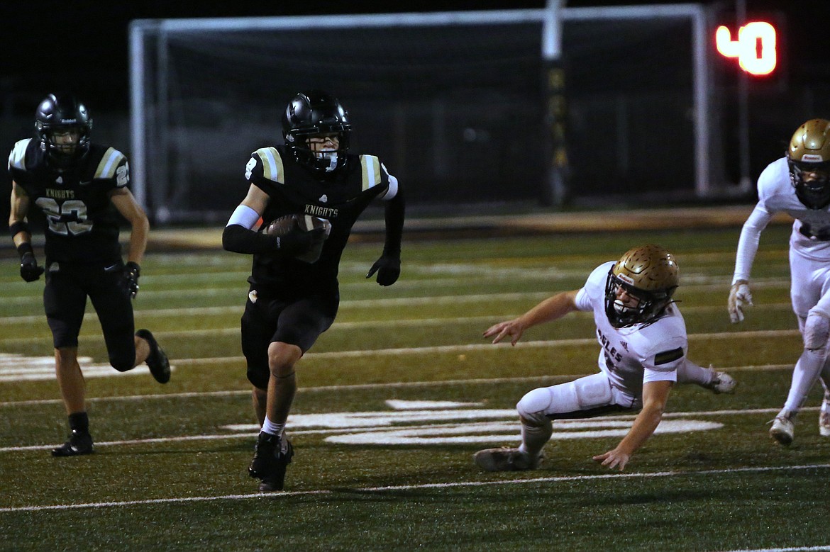 Royal senior Case Christensen (9) sprints upfield on a 72-yard touchdown catch against Connell on Thursday.