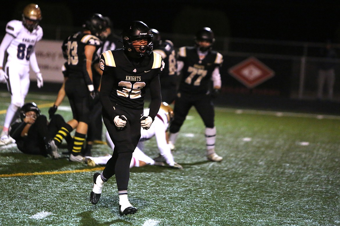 Royal junior Nathan Niebla (32) celebrates after blocking a punt in the second quarter against Connell.