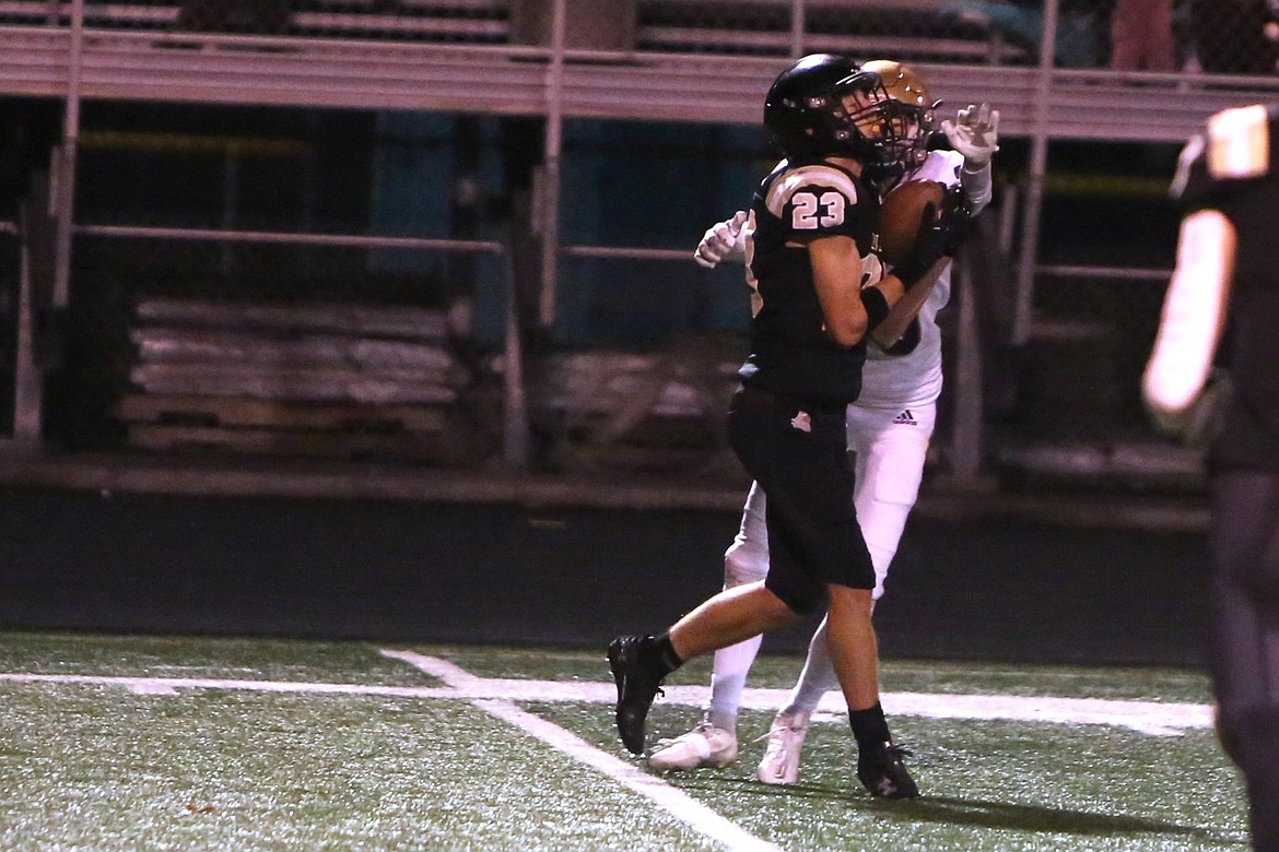 Royal sophomore Shea Stevenson (23) intercepts a pass in the first half against Connell.