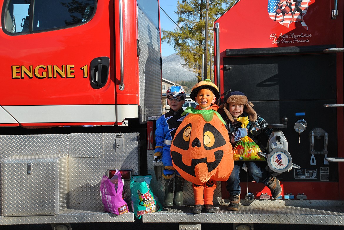 The St. Regis Volunteer Fire Department's Fire Truck was a bit hit for the kiddos, and they helped with blockading the street. The Mineral County Sheriff's Department also provided patrol cars for keeping the other end of Tiger Street safe and giving out candy. (Mineral Independent/Amy Quinlivan)