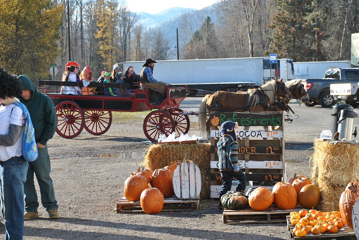 The Black Diamond Guest Ranch out of DeBorgia, once again graciously provided old fashioned wagon rides during the Fall Festival by donation only. Bonnie and Clyde took festival goers for a jaunt passed the St. Regis Park lead by Aaron Todd. (Mineral Independent/Amy Quinlivan)