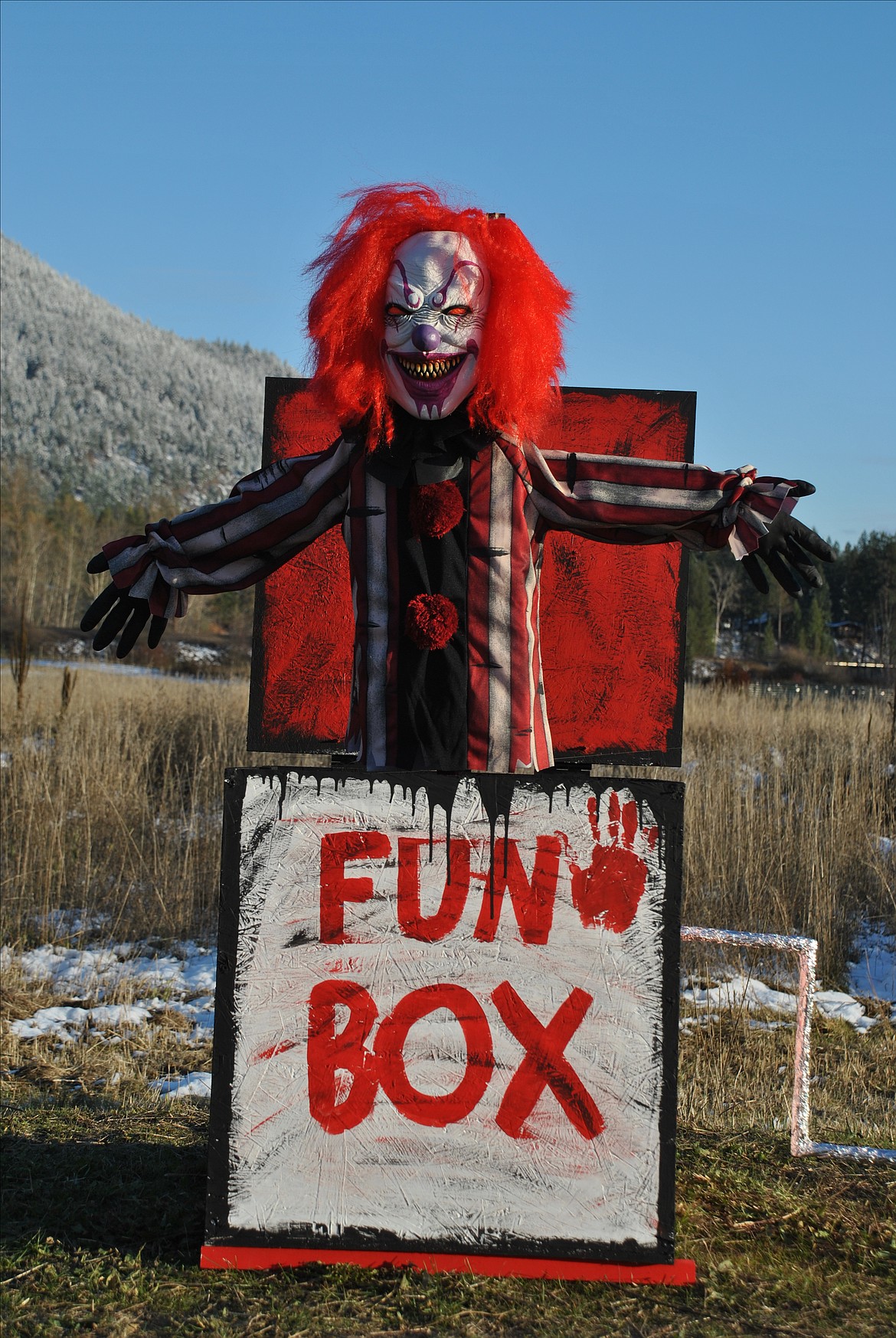 A spooky clown pops out of his "Fun Box". This red creation was created by the Funke Family in St. Regis.(Mineral Independent/Amy Quinlivan)