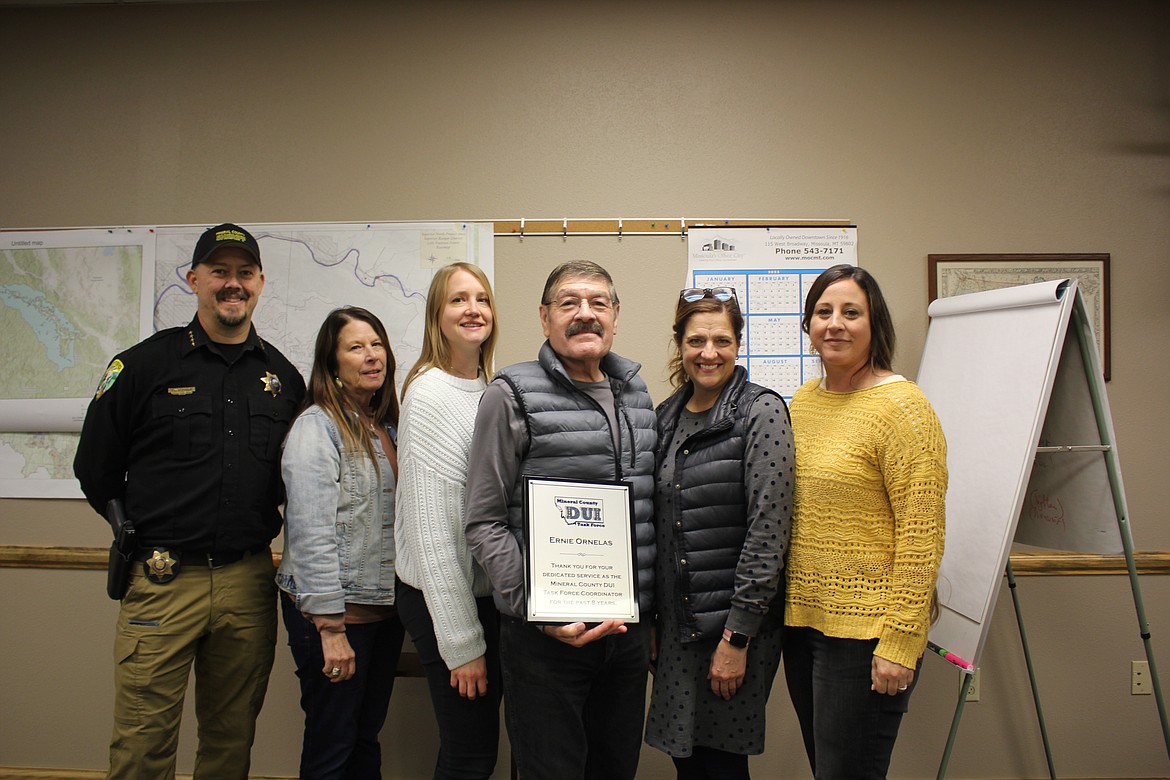 Mineral County DUI Task Force members Sheriff Ryan Funke, Commissioner Dawn Terrill, Anna Schreck, Prevention Specialist for Mineral County/Western Montana Mental Health Center, Ernie Ornelas, Barb Jasper, Mineral County Health Department, and Stephanie Quick, Frontier Counseling presented Ornelas with an appreciation plaque for his eight years as the DUI Task Force Coordinator. He remains on the task force as the advisory committee approaches the new year with underage drinking a higher priority from new research in Mineral County. (Monte Turner/Mineral Independent)