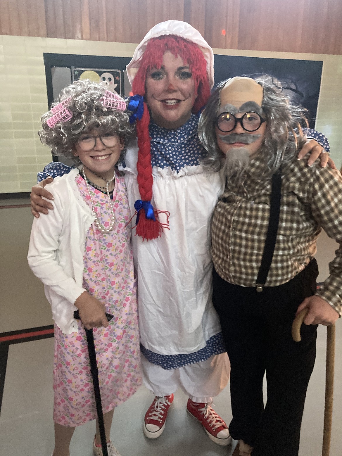 Sydnie Eichert and an old lady, PTO president Echo Zeretzke as Raggedy Anne, and Kaylie Mercer as an old man. (Photo provided)