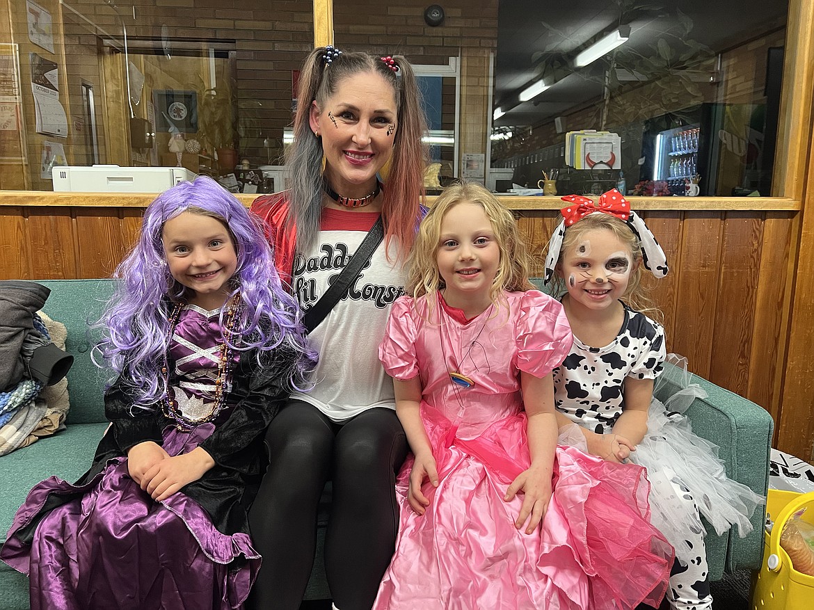 Purple witch Emma Mercer, teacher Lara Oldenburg as Harley Quinn, pink princess McKenzie Norton, and dalmatian puppy Kyia Posselt. (Photo provided)