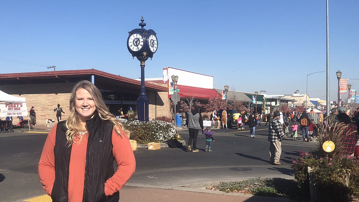 Mallory Miller, director of DMLA, oversees Harvest Festival around Sinkiuse Square in Moses Lake.