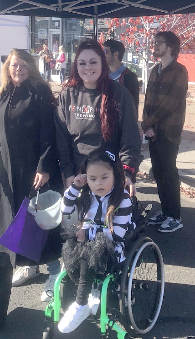 Marlea Moreno and daughter Cataleia enjoy goodies from 1-2 p.m. at the Harvest Festival.