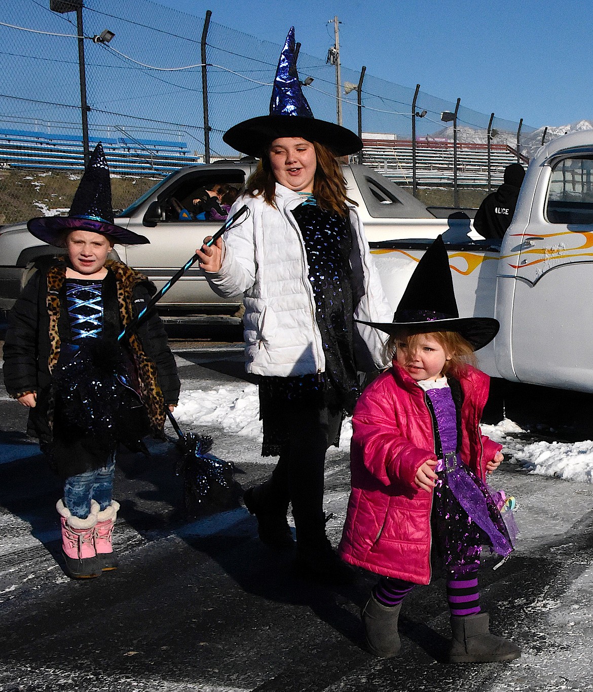 The Hocus Pocus sisters, Harley Cullinan, left, Alice Mayne, and Alissa Siple are ready to trick or trunk at the Mission Valley Super Oval. (Berl Tiskus/Leader)