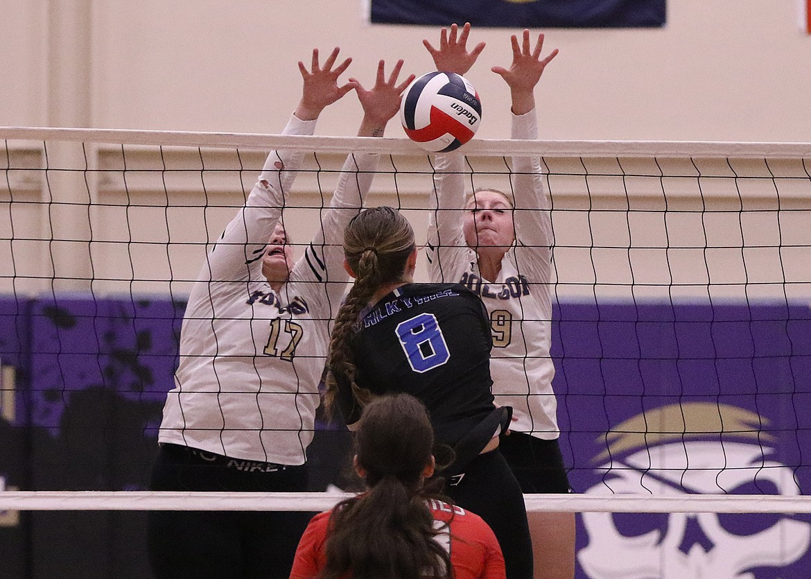 Lady Pirate Kellyn Nelson blocks Bigfork hitter during last Tuesday's matchup. (Bob Gunderson photo)