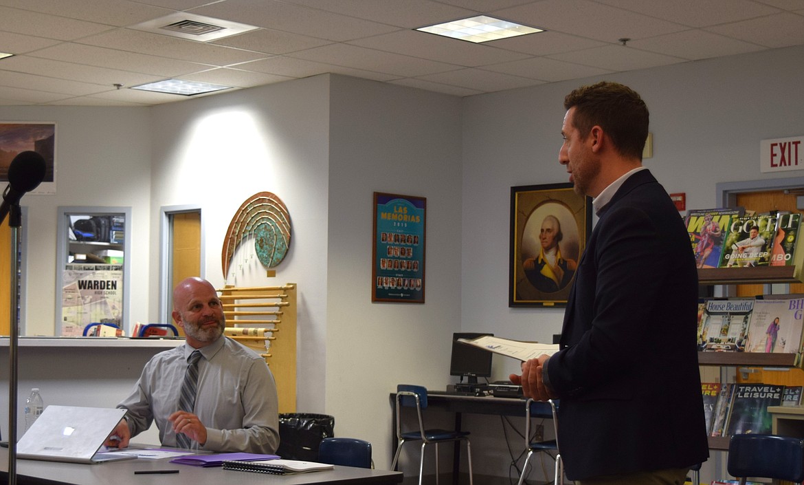 D.A. Davidson & Co. Managing Director Cory Plager, right, presents the Warden School District’s options for levy renewals to the Warden School District Superintendent Scott West, right, and Warden School Board members during the Oct. 12 meeting.