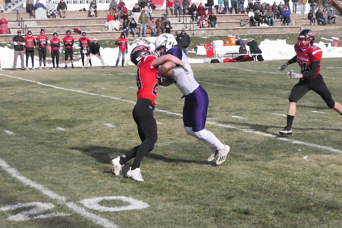 Savage Heat running back/linebacker Johnny Waterbury tackles Valier running back Jonas Horn (7) during first half action of their playoff game Saturday in Hot Springs.  The Heat won 40-6 to advance to the second round this coming Saturday, also at home. (Chuck Bandel/VP-MI)