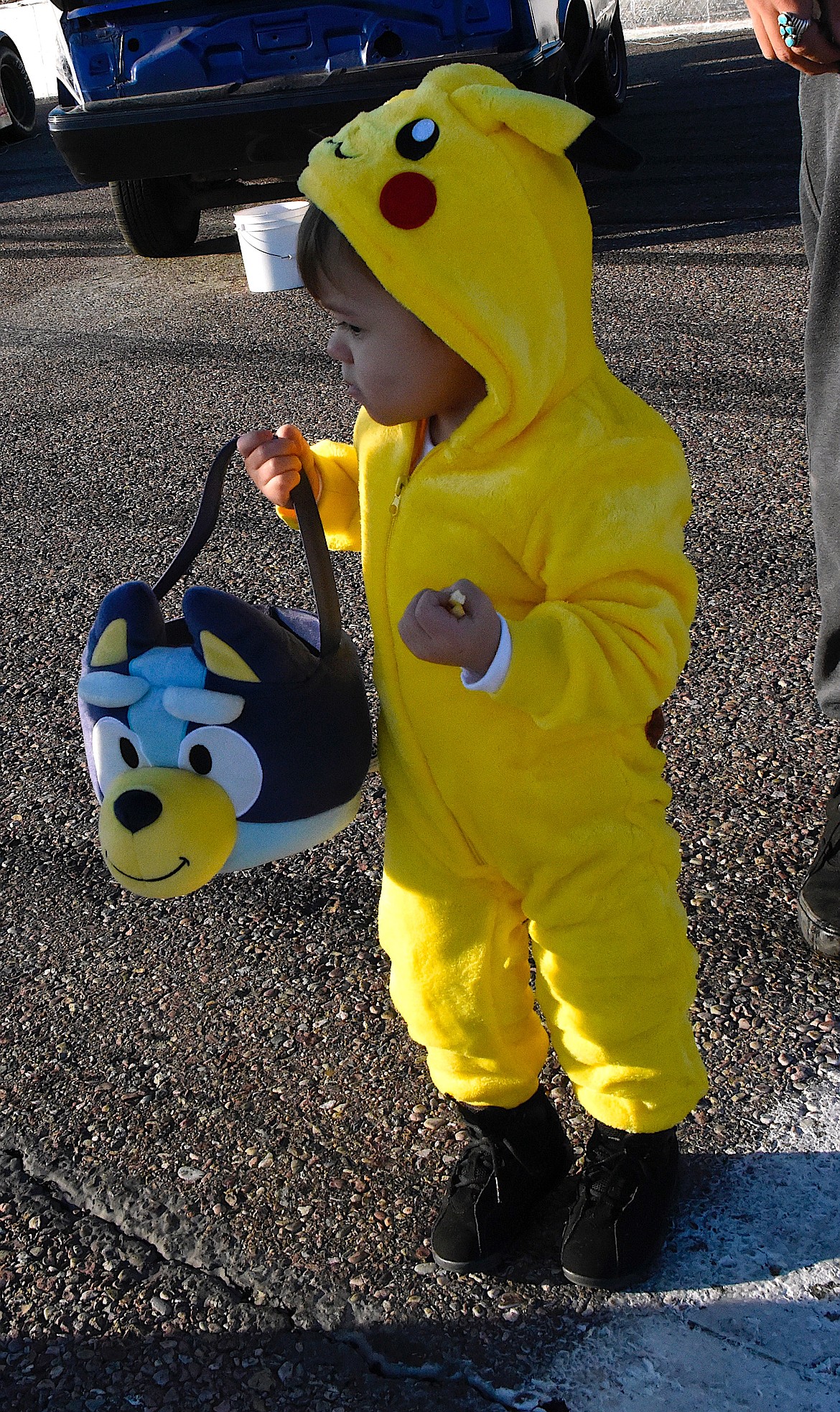 This pikachu named Heath is interested in all the pumpkins, the other kids, and the buckets of candy. (Berl Tiskus/Leader)