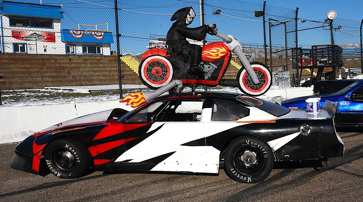 A skeletal biker readies himself for a moonlight ride as soon as the Mission Valley Super Oval Trick or Trunk is completed. (Berl Tiskus/Leader)