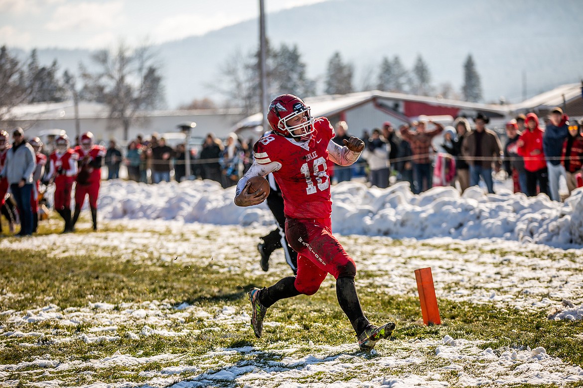 Warrior Jake Knoll races for the endzone during Saturday's game against Flint Creek. (Jamie Sievers photo)