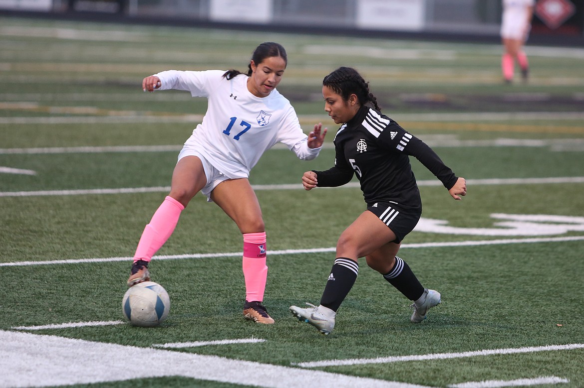 Royal sophomore Sharon Arroyo, right, moves toward a La Salle forward.