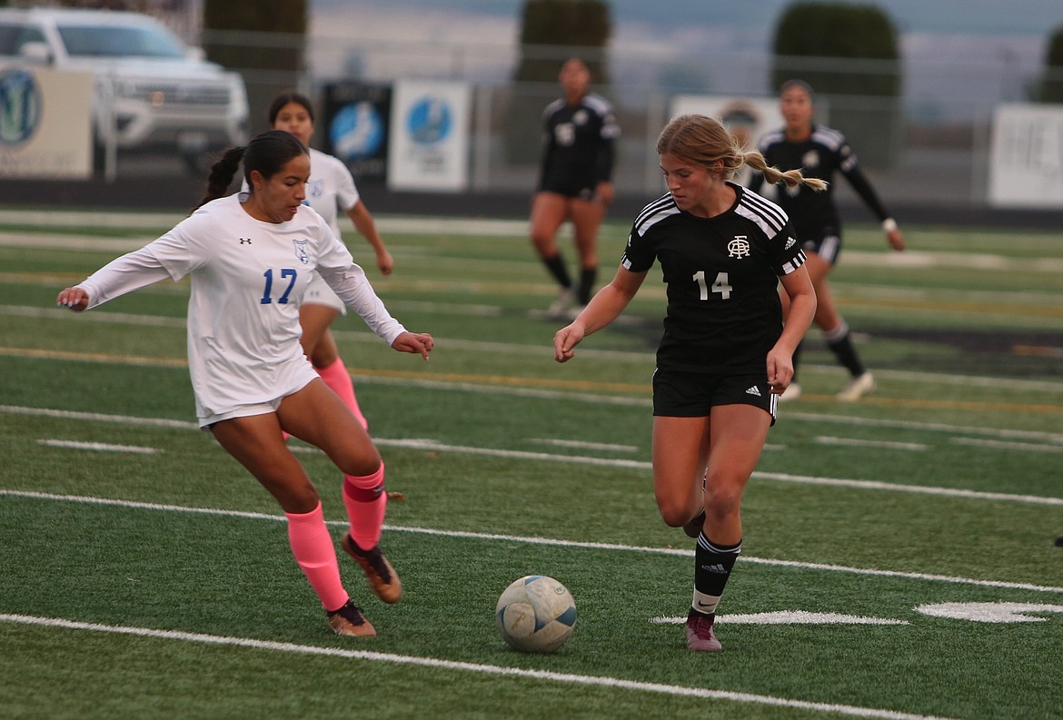 Royal freshman Maggie Frank (14) runs upfield with the ball against La Salle.