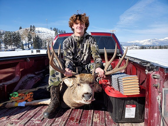 Cormack Batt with mule deer he harvested in Bitterroot Valley hunting district 270. (FWP photo)