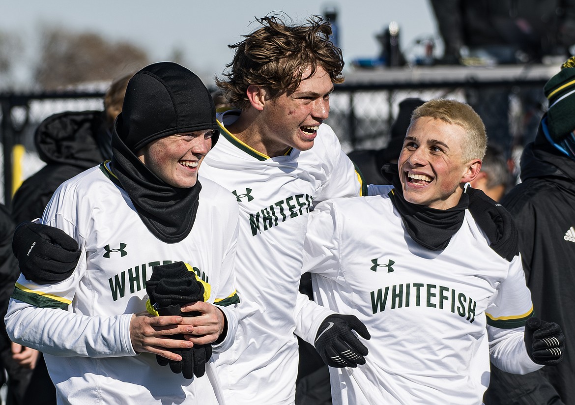 Whitefish's Griffin Gunlikson, Charlie Hyatt, and Logan Bingham celebrate after winning the 2023 Class A Boys Soccer Championship against Billings Central at Amend Park in Billings on Saturday, Oct. 28.