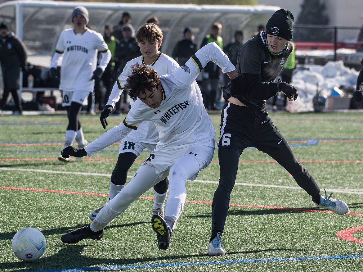 Billings Central's Russell Johnson attempts to block Whitefish's Adam Healy during the 2023 Class A Boys Soccer Championship at Amend Park in Billings on Saturday, Oct. 28.