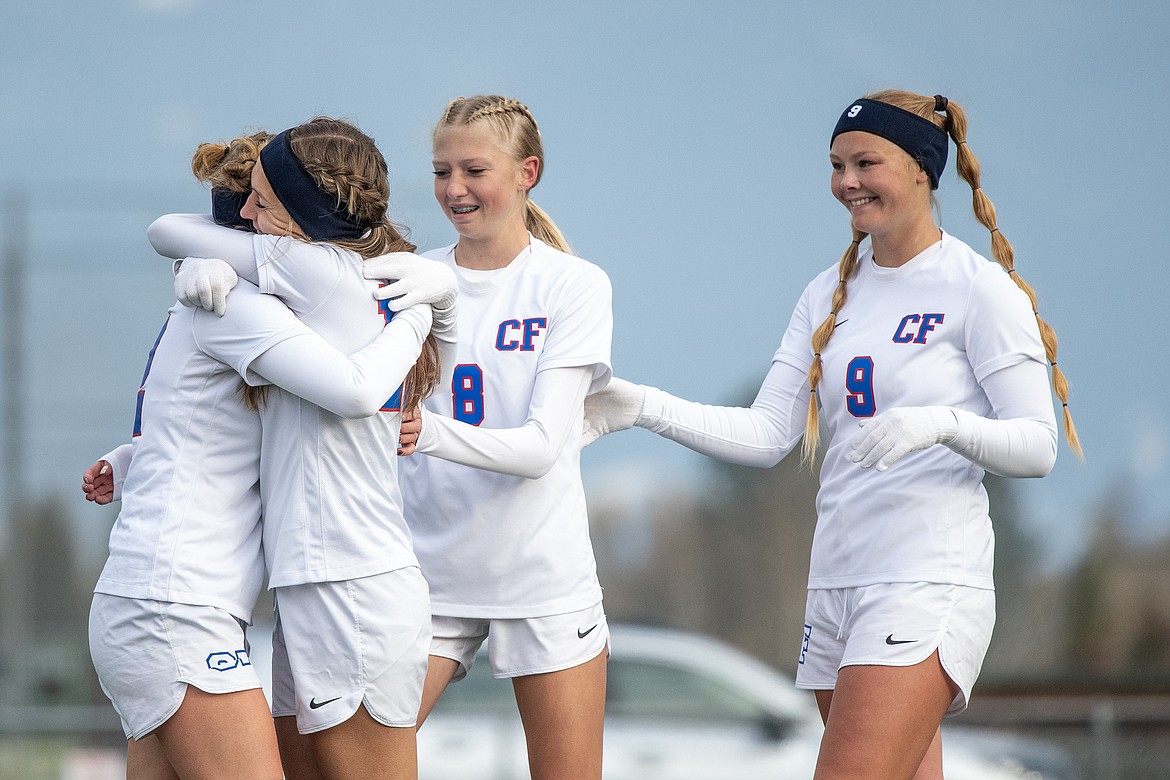 McKenzee West, Onnikka Lawrence and Hope McAtee celebrate Josie Harris’s (far left) goal in the second half of the Montana A girls soccer championship against Whitefish on Saturday, Oct. 28.